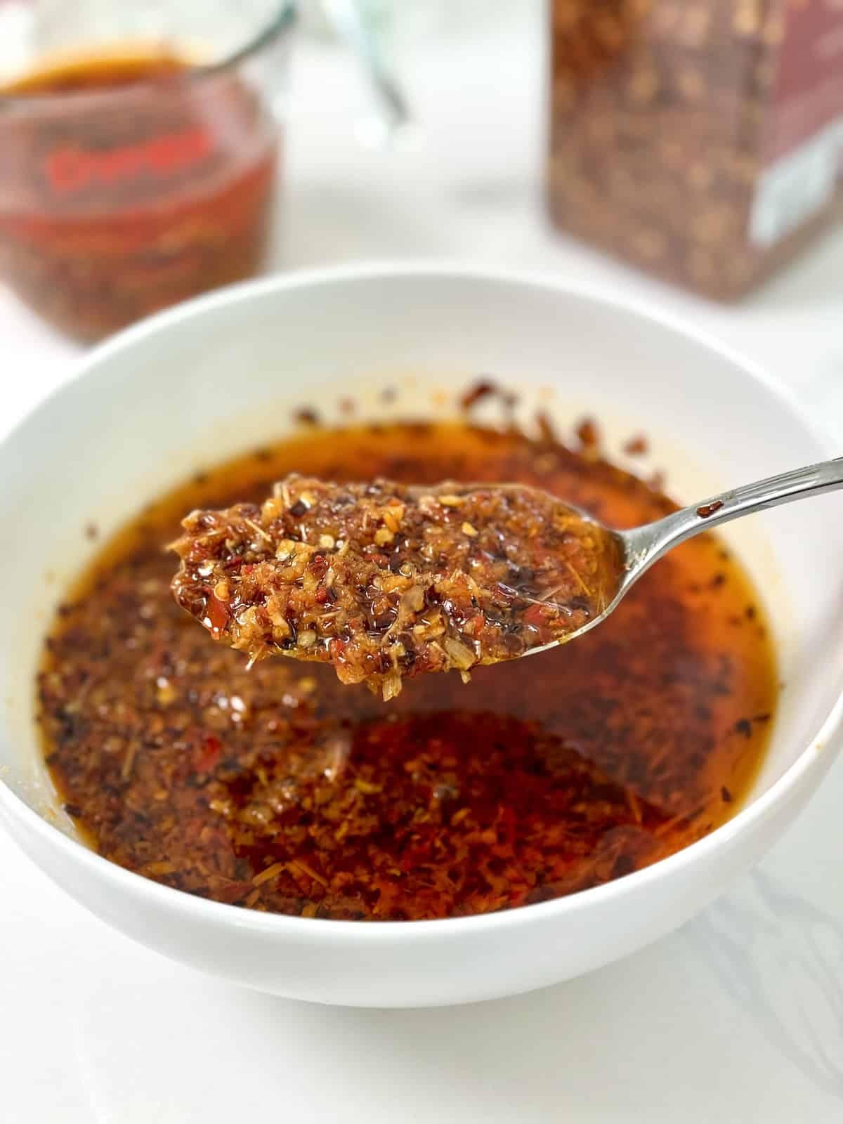 sweet chili infused condiment crossword