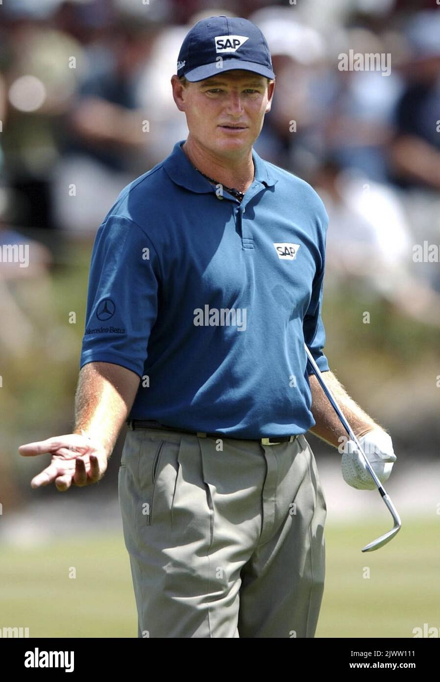 South African Golfer Ernie Els Looks To His Caddy For Questions On His Way To Playing A Triple Boogey On The Fourth On The Last Day Of The Heineken Classic Golf Tournament